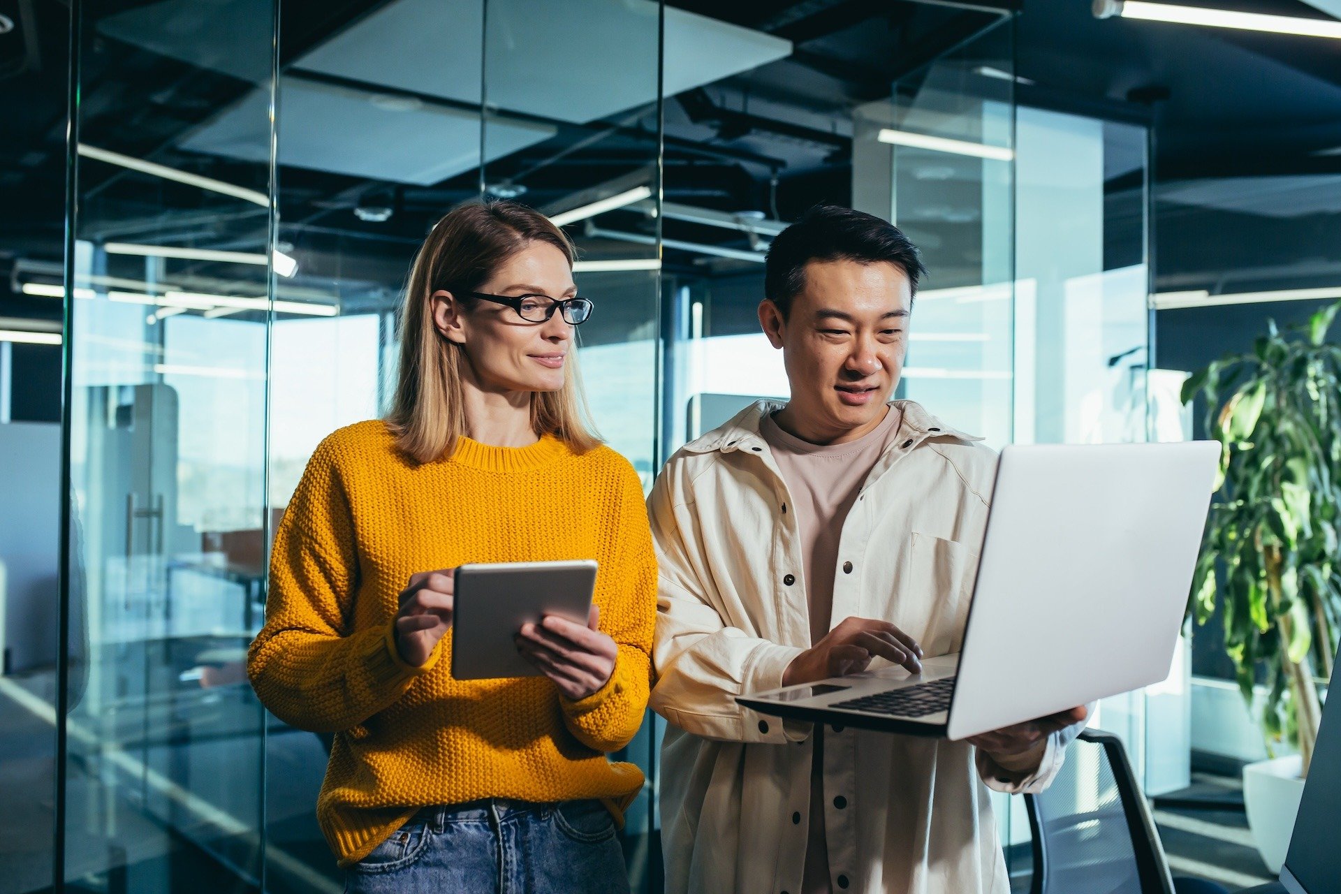 Image of two colleagues reviewing data backup and recovery plans