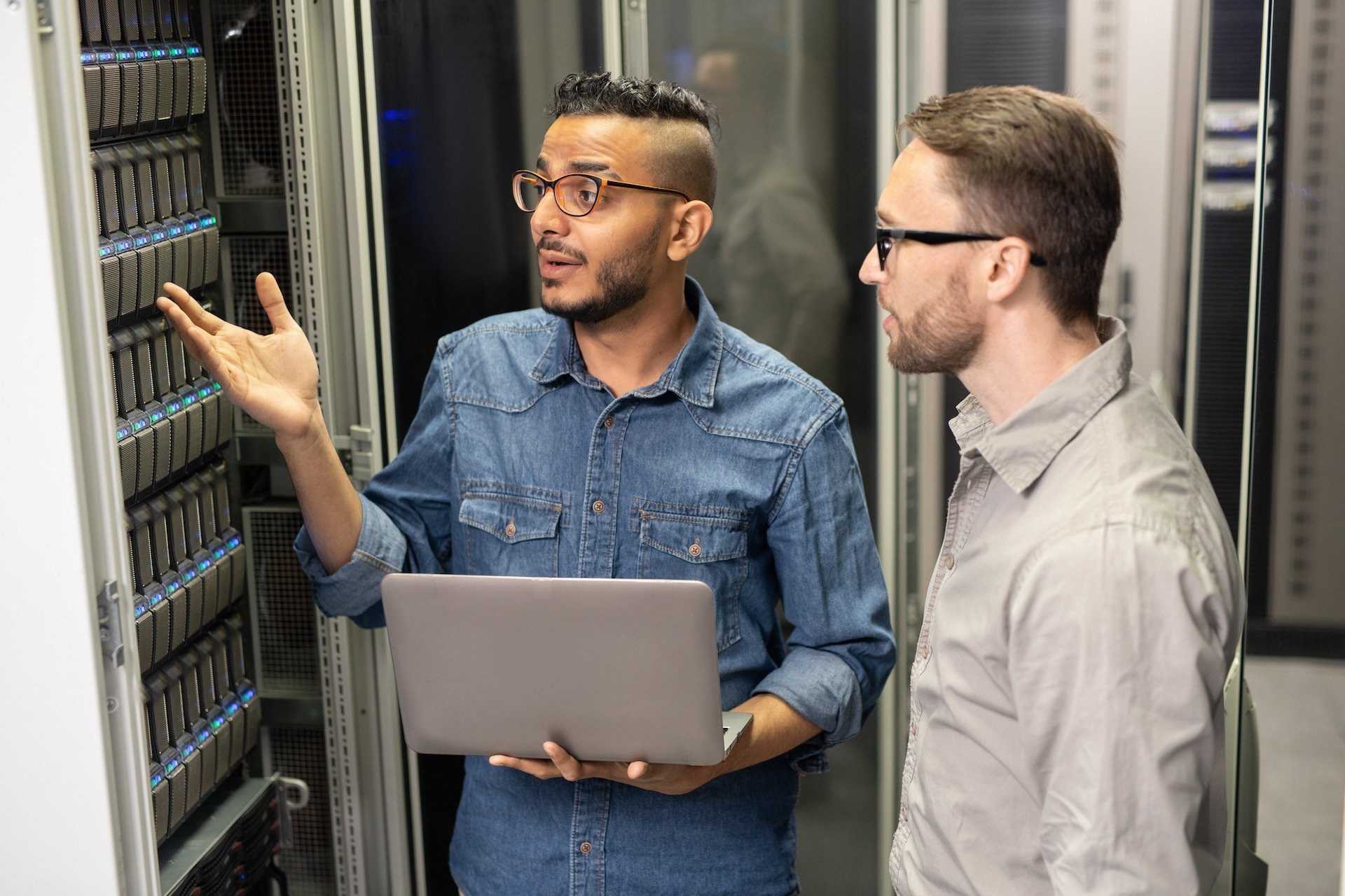 Image of two colleagues reviewing network infrastructure